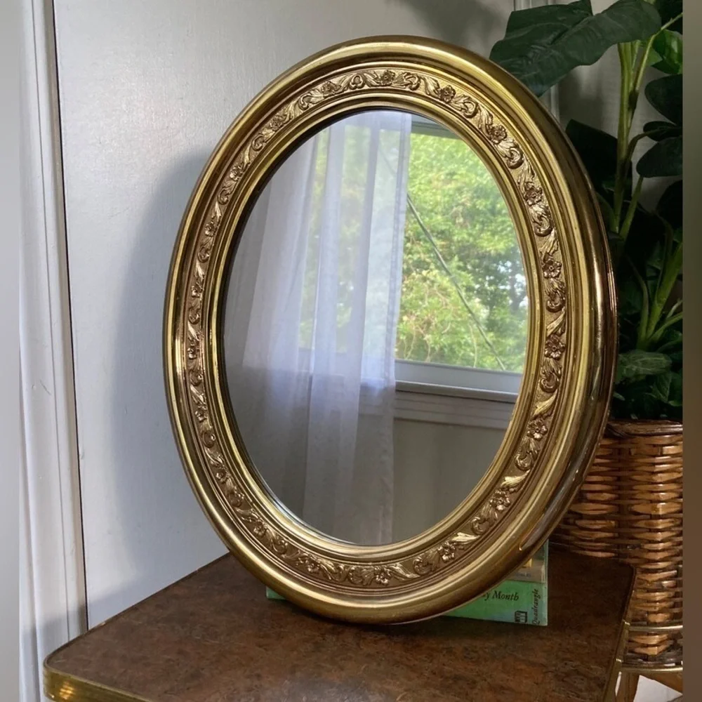 beautiful vintage gold plastic oval mirror